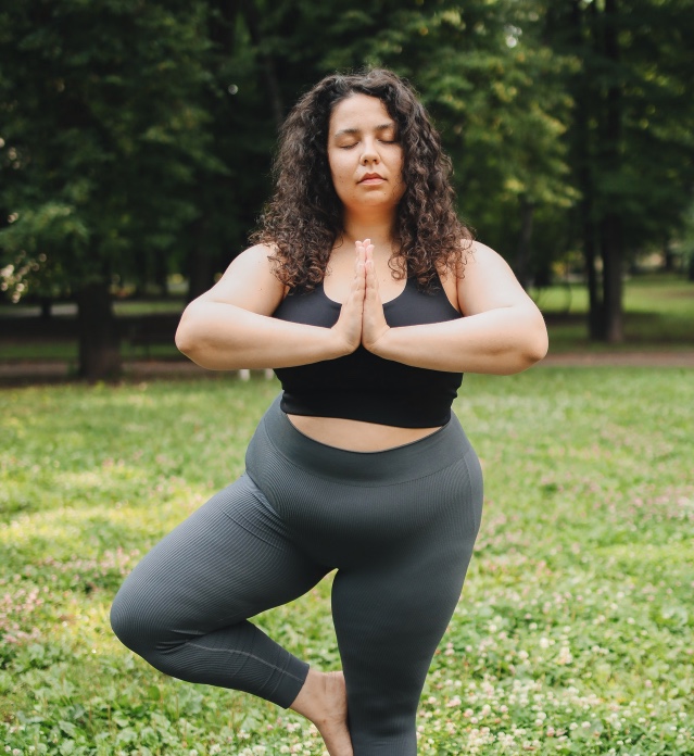 Woman doing tree pose yoga